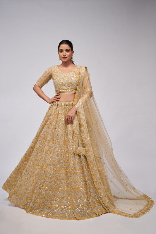 Golden Coloured with a Leaves Pattern Embellished with Golden Sequins, Stones & Cut Dana work Women Ethnic Party wear Lehenga Choli with Dupatta!!