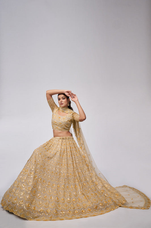 Golden Coloured with a Leaves Pattern Embellished with Golden Sequins, Stones & Cut Dana work Women Ethnic Party wear Lehenga Choli with Dupatta!!