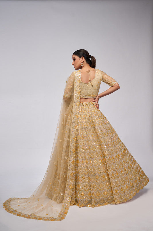 Golden Coloured with a Leaves Pattern Embellished with Golden Sequins, Stones & Cut Dana work Women Ethnic Party wear Lehenga Choli with Dupatta!!