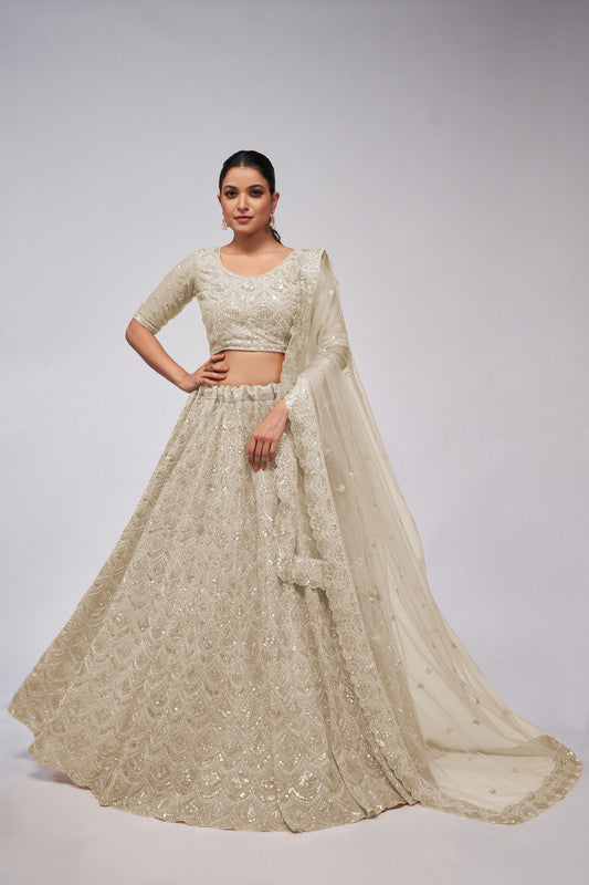 Ivory Coloured with a Leaves Pattern Embellished with Golden Sequins, Stones & Cut Dana work Women Ethnic Party wear Lehenga Choli with Dupatta!!