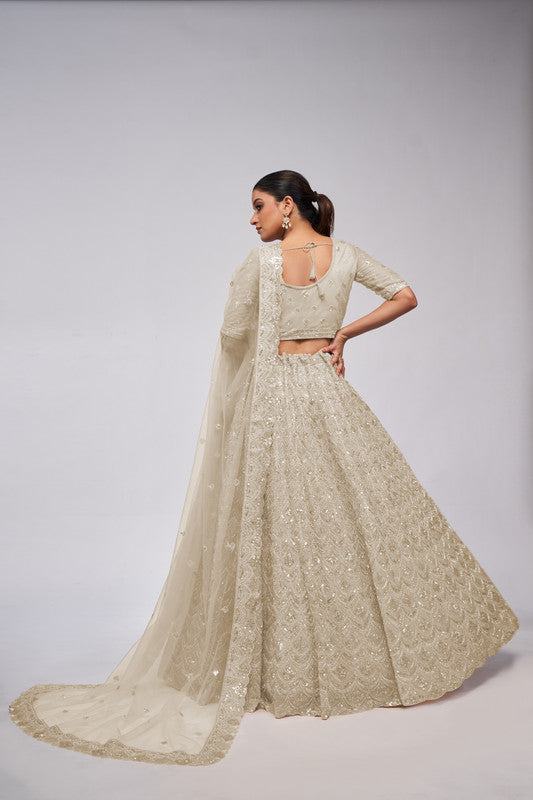 Ivory Coloured with a Leaves Pattern Embellished with Golden Sequins, Stones & Cut Dana work Women Ethnic Party wear Lehenga Choli with Dupatta!!