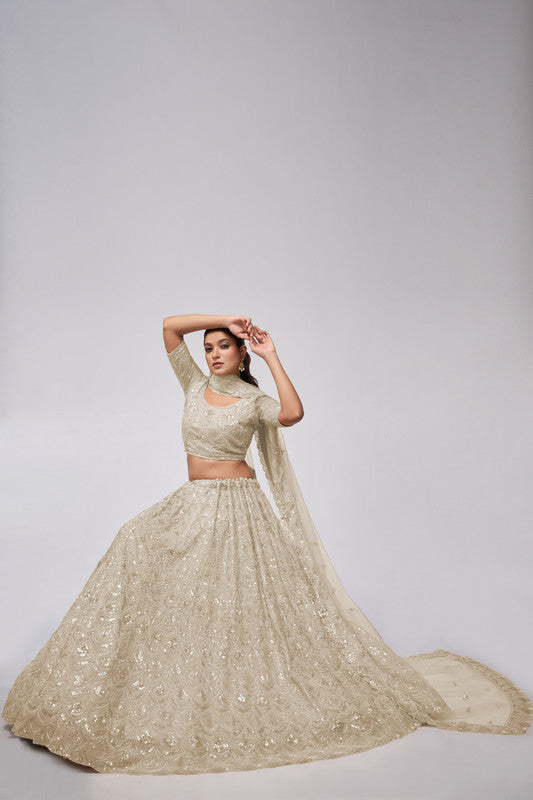 Ivory Coloured with a Leaves Pattern Embellished with Golden Sequins, Stones & Cut Dana work Women Ethnic Party wear Lehenga Choli with Dupatta!!