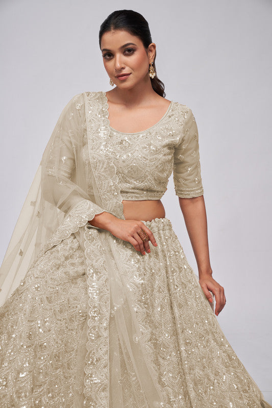 Ivory Coloured with a Leaves Pattern Embellished with Golden Sequins, Stones & Cut Dana work Women Ethnic Party wear Lehenga Choli with Dupatta!!